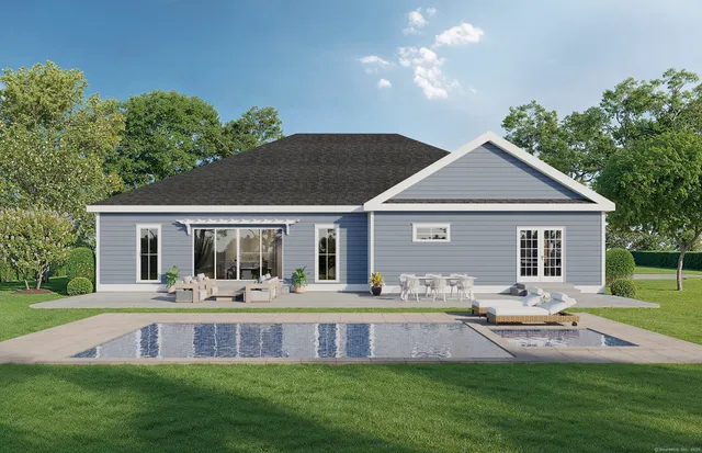 a front view of house with a garden and patio