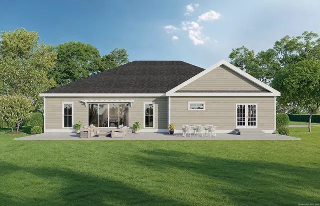 a front view of house with a garden and yard