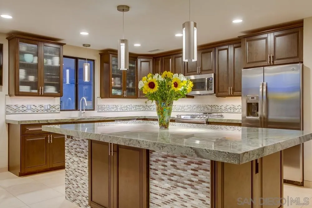 10 Sixpence Way Coronado, CA 92118 - Photo 13 of 23 a kitchen with stainless steel appliances granite countertop a sink and a refrigerator