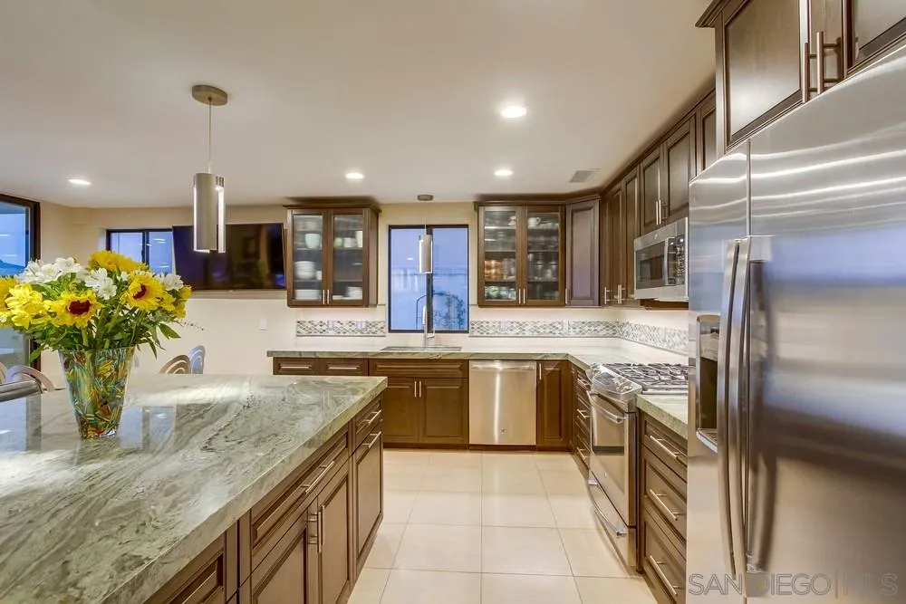 10 Sixpence Way Coronado, CA 92118 - Photo 15 of 23 a kitchen with stainless steel appliances granite countertop sink stove and cabinets