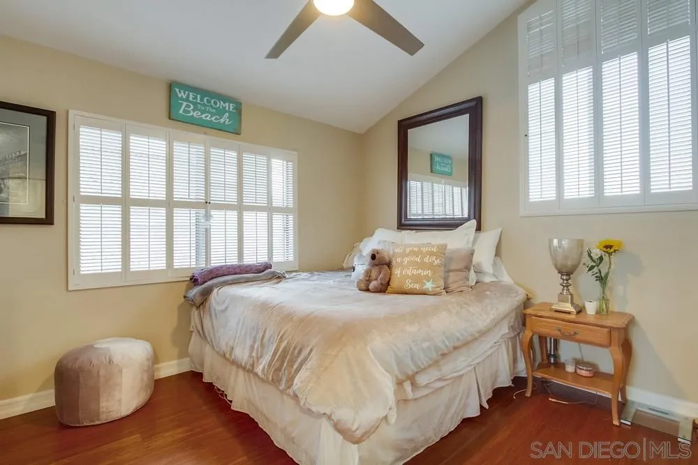 10 Sixpence Way Coronado, CA 92118 - Photo 20 of 23 a bedroom with a bed and wooden floor