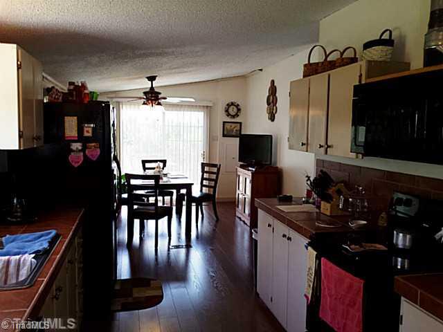 1038 Creekside Way Road Pinnacle, NC 27043 - Photo 6 of 6 Kitchen. Open floor plan kitchen and dining