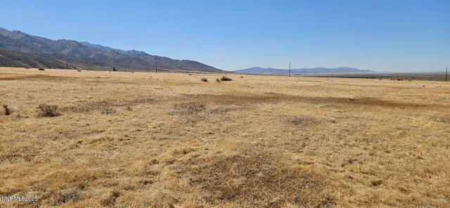 a view of an ocean and a mountain