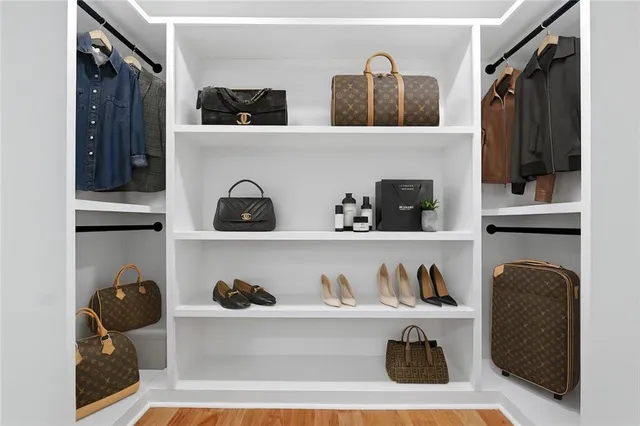 a white bath tub sitting in a bathroom next to a window
