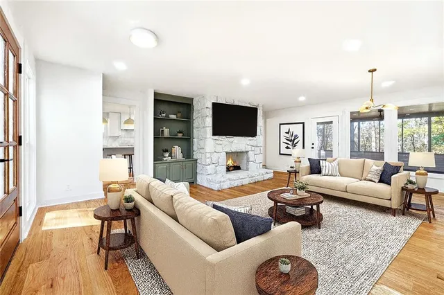 a living room with furniture and a flat screen tv