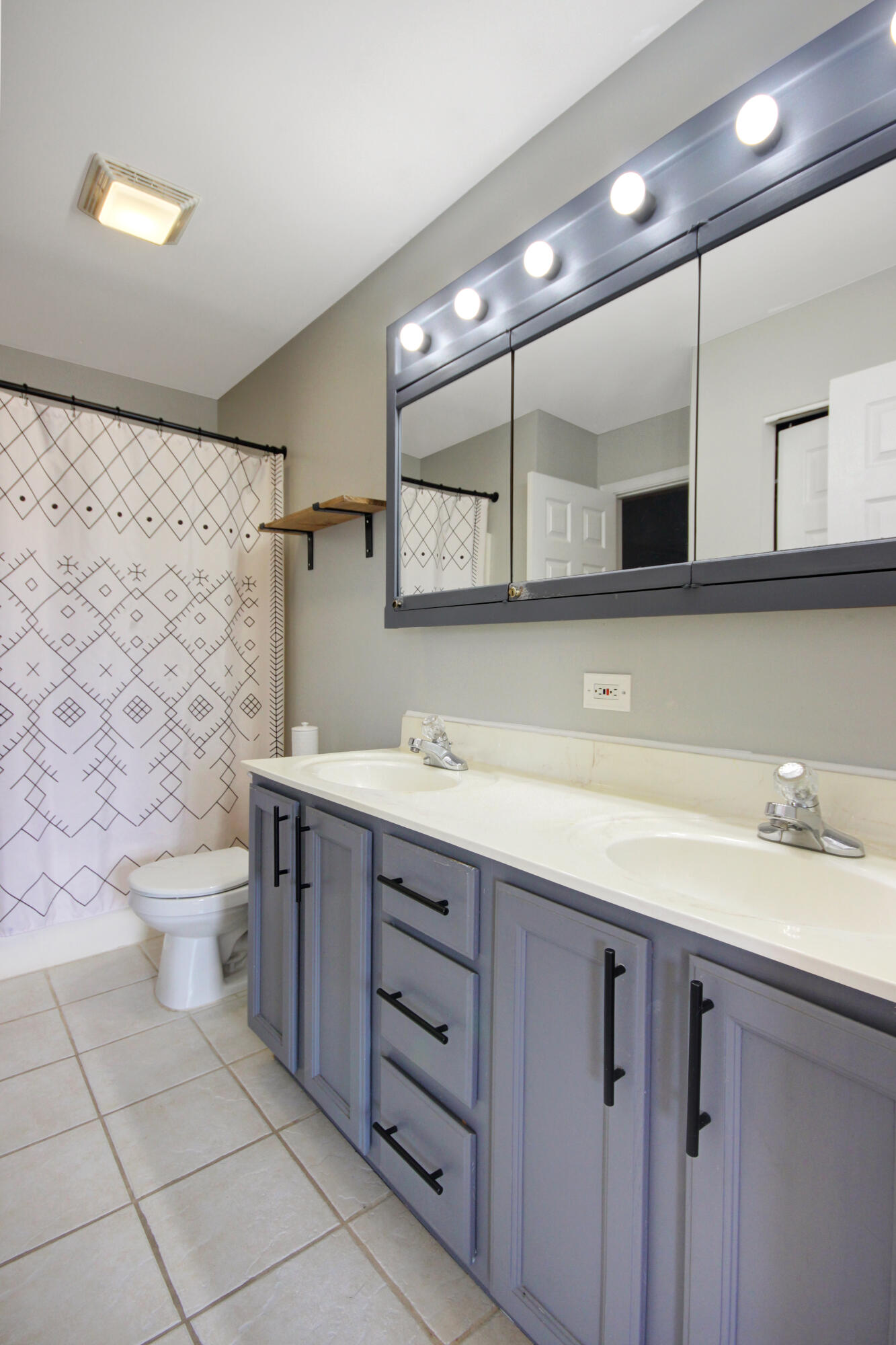 8109 Victoria Place Crown Point, IN 46307 - Photo 12 of 26 a bathroom with a sink toilet and a mirror