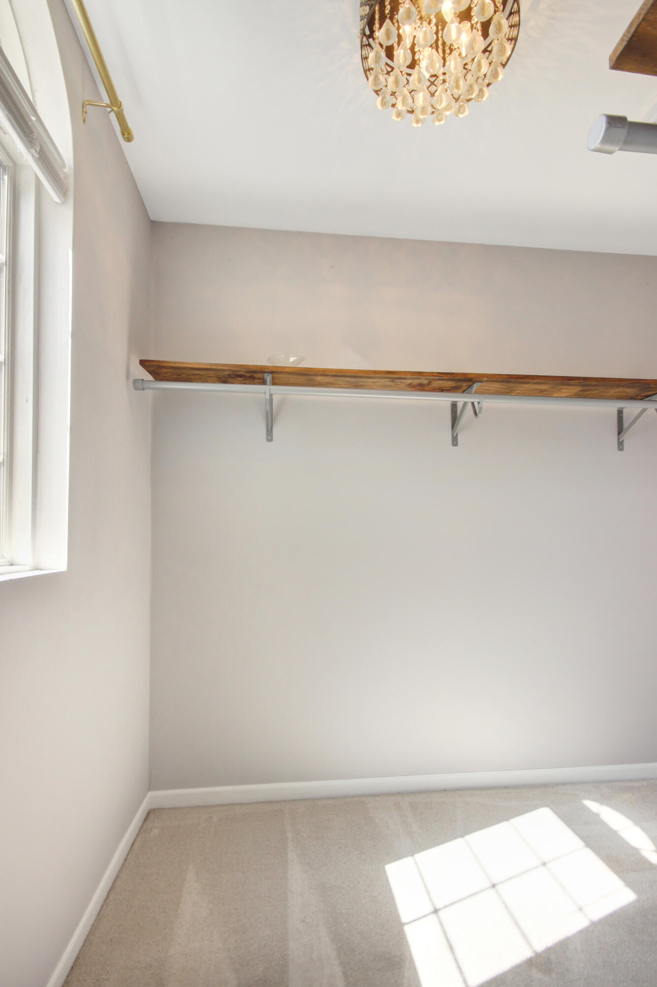 8109 Victoria Place Crown Point, IN 46307 - Photo 14 of 26 a view of a closet with wooden floor