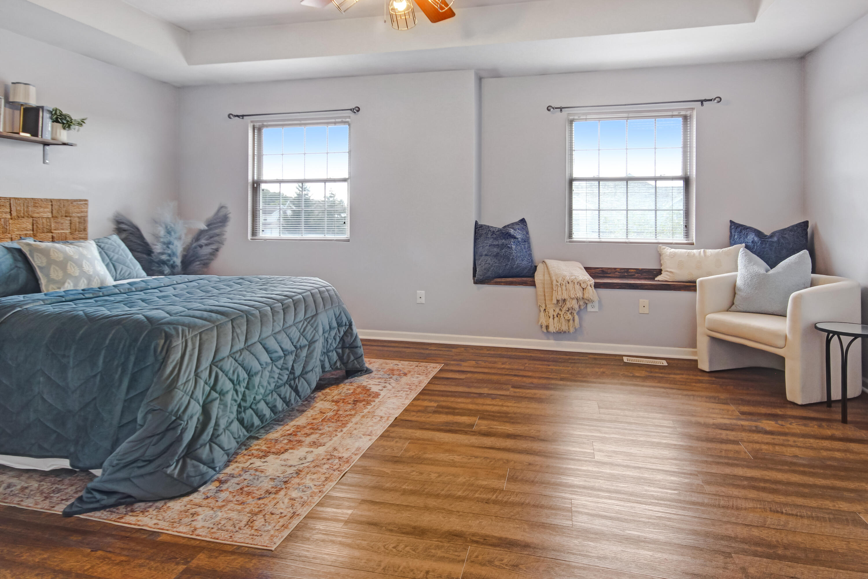 8109 Victoria Place Crown Point, IN 46307 - Photo 16 of 26 a spacious bedroom with a bed and wooden floor