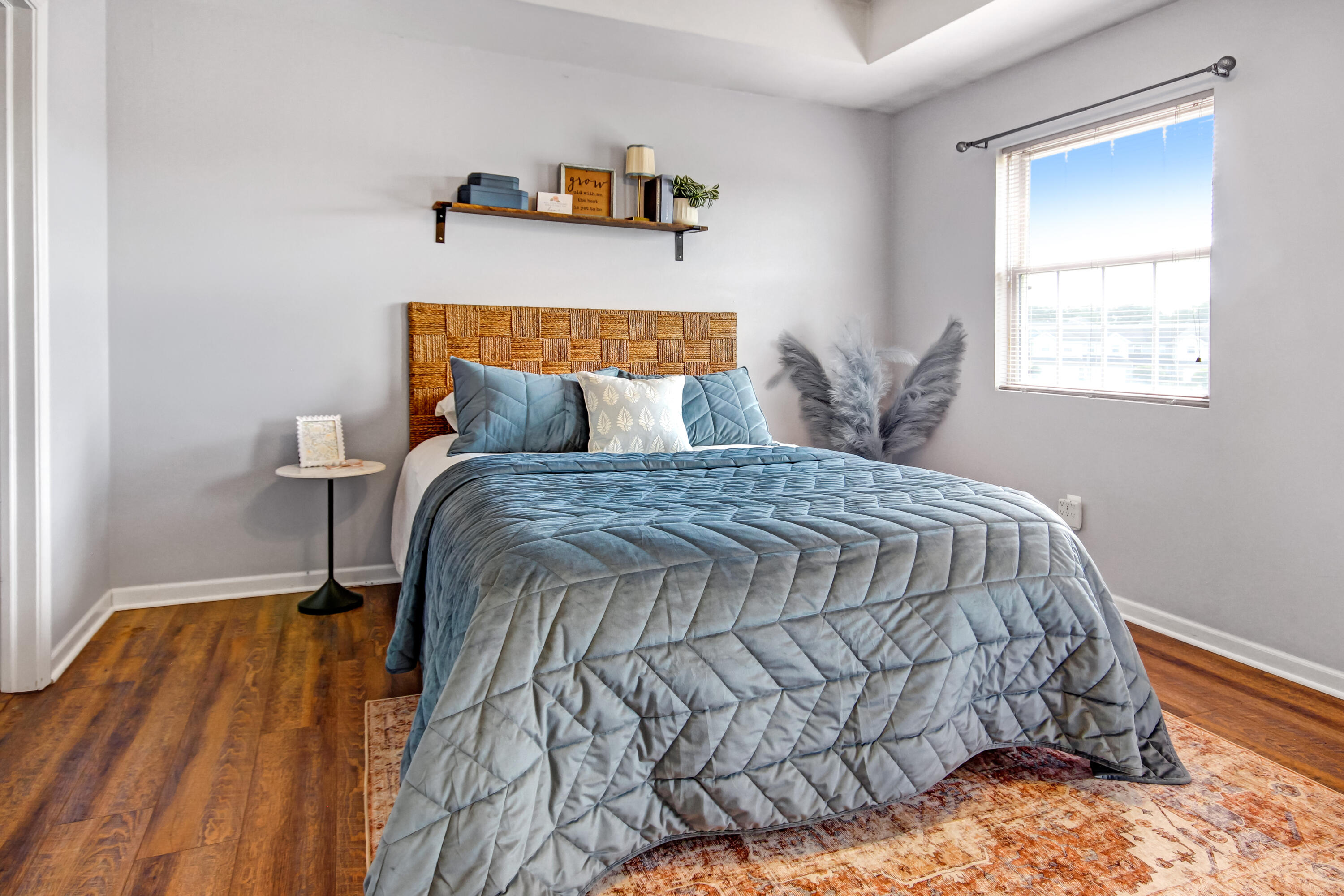 8109 Victoria Place Crown Point, IN 46307 - Photo 17 of 26 a bed sitting in a bedroom next to a window