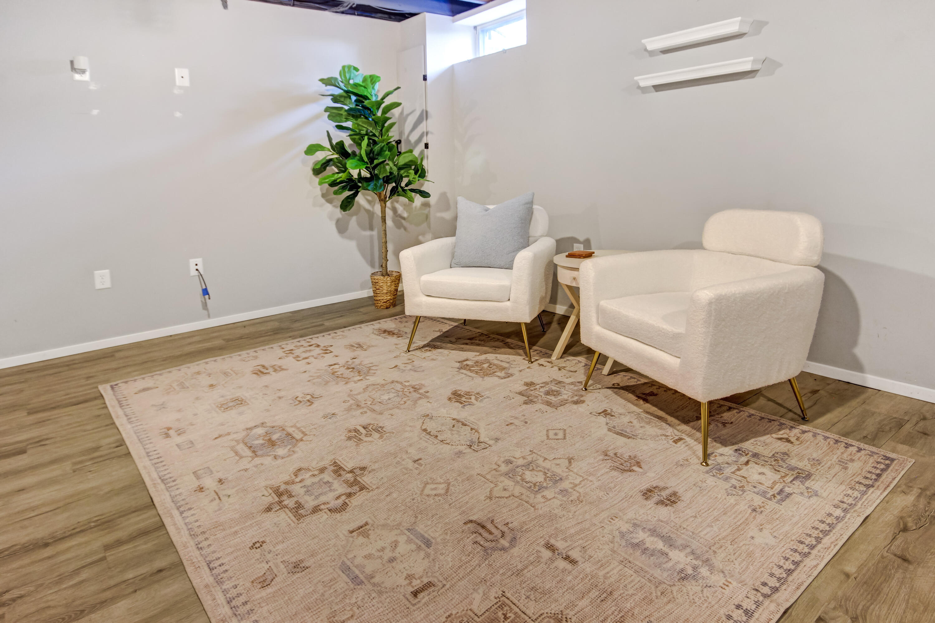 8109 Victoria Place Crown Point, IN 46307 - Photo 20 of 26 a white bed sitting in a bedroom next to a potted plant