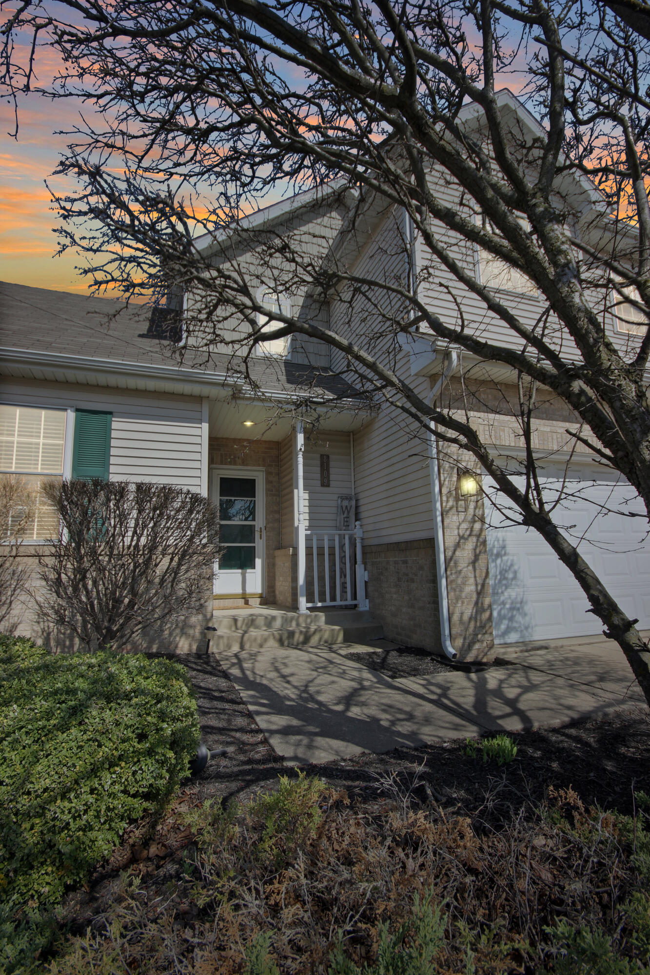 8109 Victoria Place Crown Point, IN 46307 - Photo 2 of 26 a front view of a house with a yard