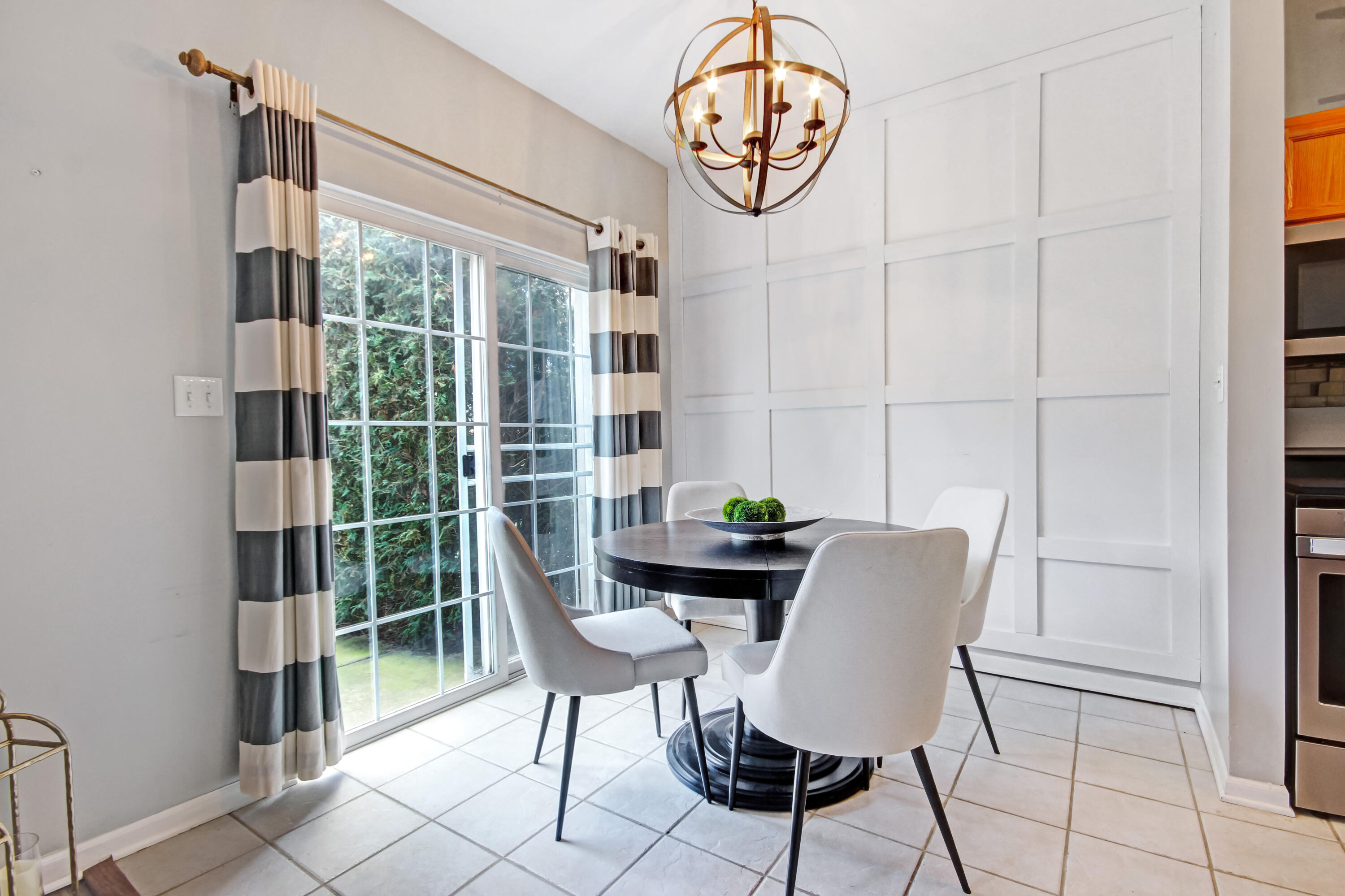 8109 Victoria Place Crown Point, IN 46307 - Photo 8 of 26 a view of a room that has a table and chair