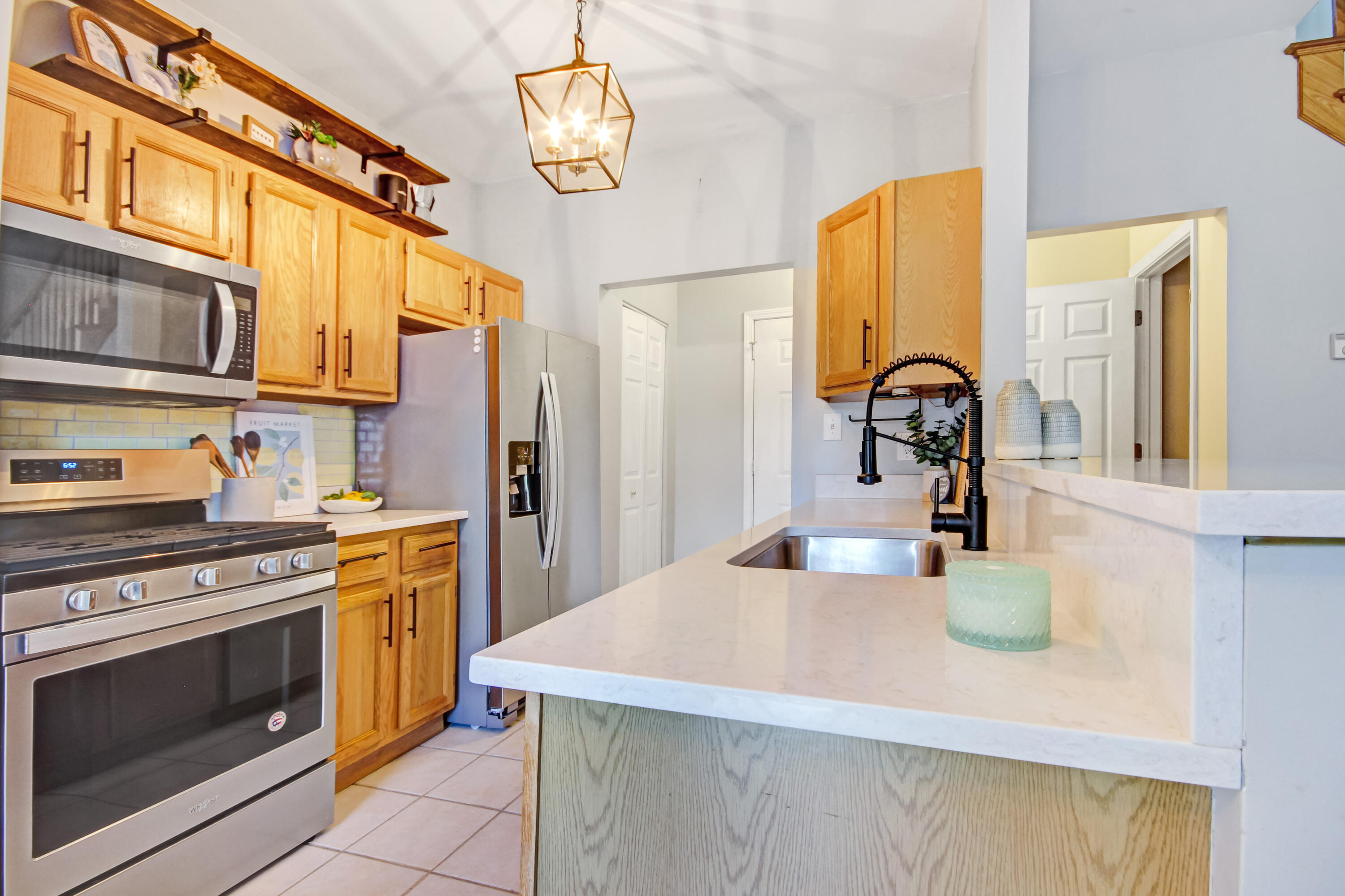 8109 Victoria Place Crown Point, IN 46307 - Photo 10 of 26 a kitchen with a stove a sink and a refrigerator