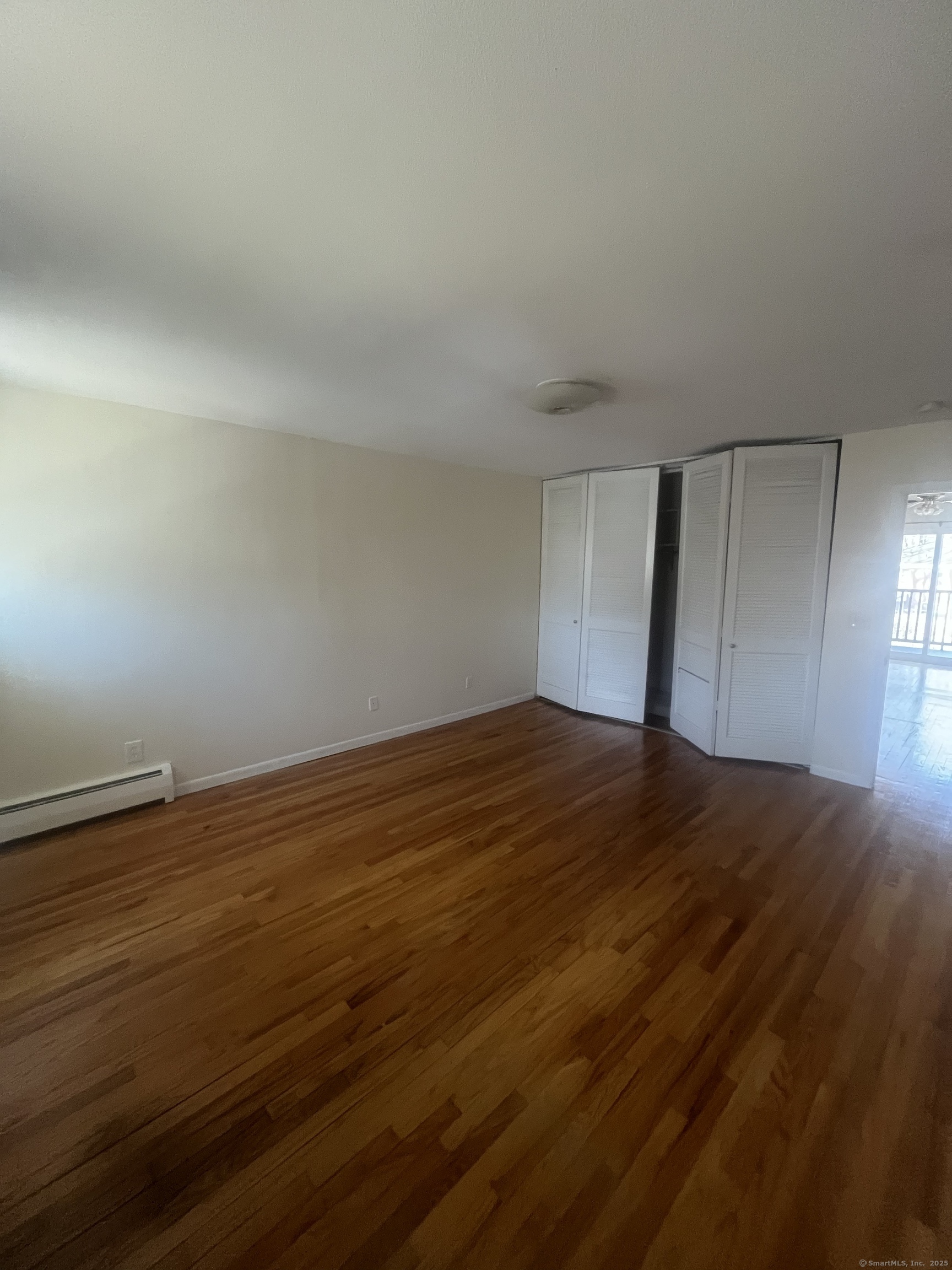 492 Fountain Street, Unit 504C2 New Haven, CT 06515 - Photo 3 of 20 a view of empty room with wooden floor