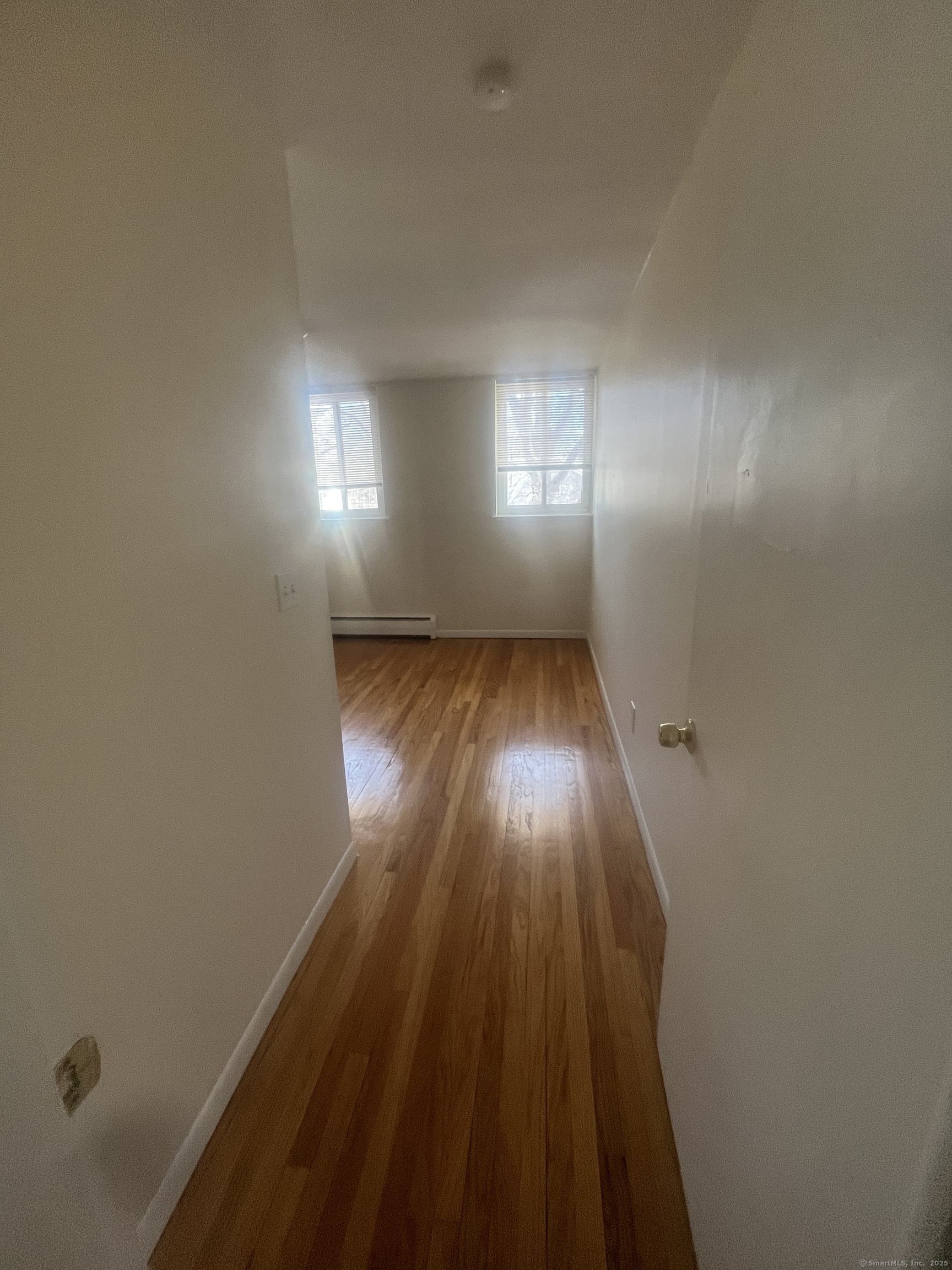 492 Fountain Street, Unit 504C2 New Haven, CT 06515 - Photo 6 of 20 a view of wooden floor and windows in a room