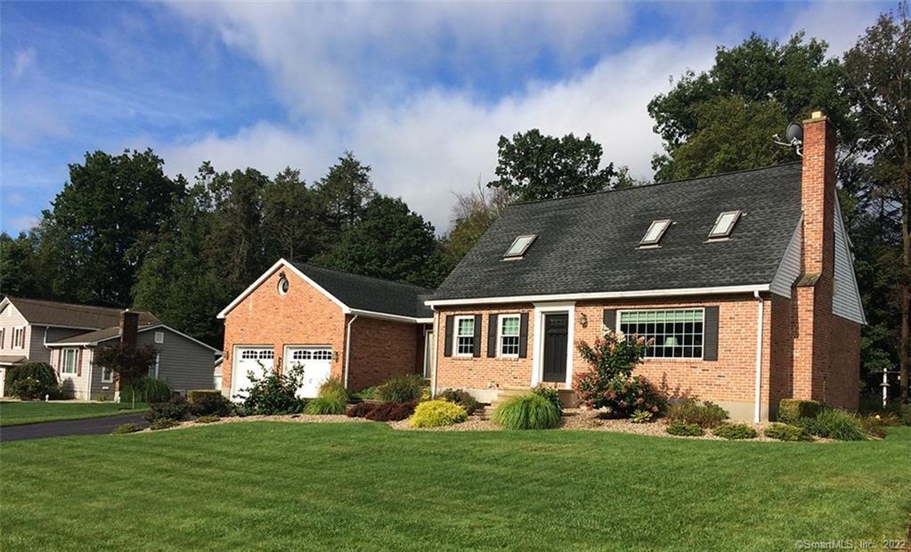 64 Pequot Road Plainville, CT 06062 - Photo 1 of 1 a front view of a house with a yard