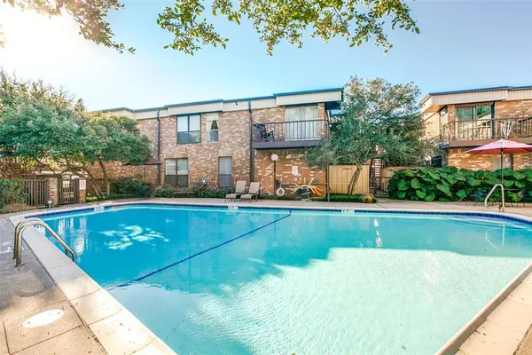 a view of swimming pool with chairs