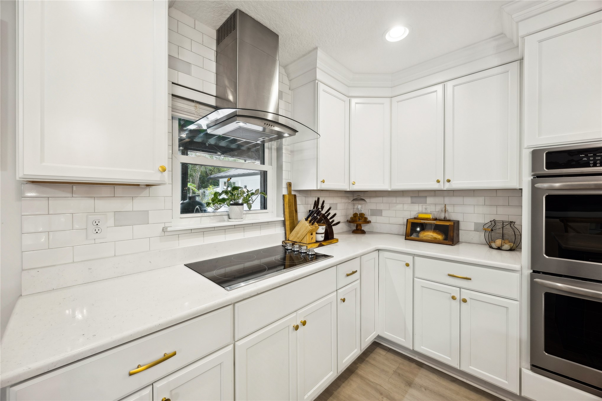 95103 Greenberry Road Fernandina Beach, FL 32034 - Photo 13 of 69 a kitchen with white cabinets and white appliances