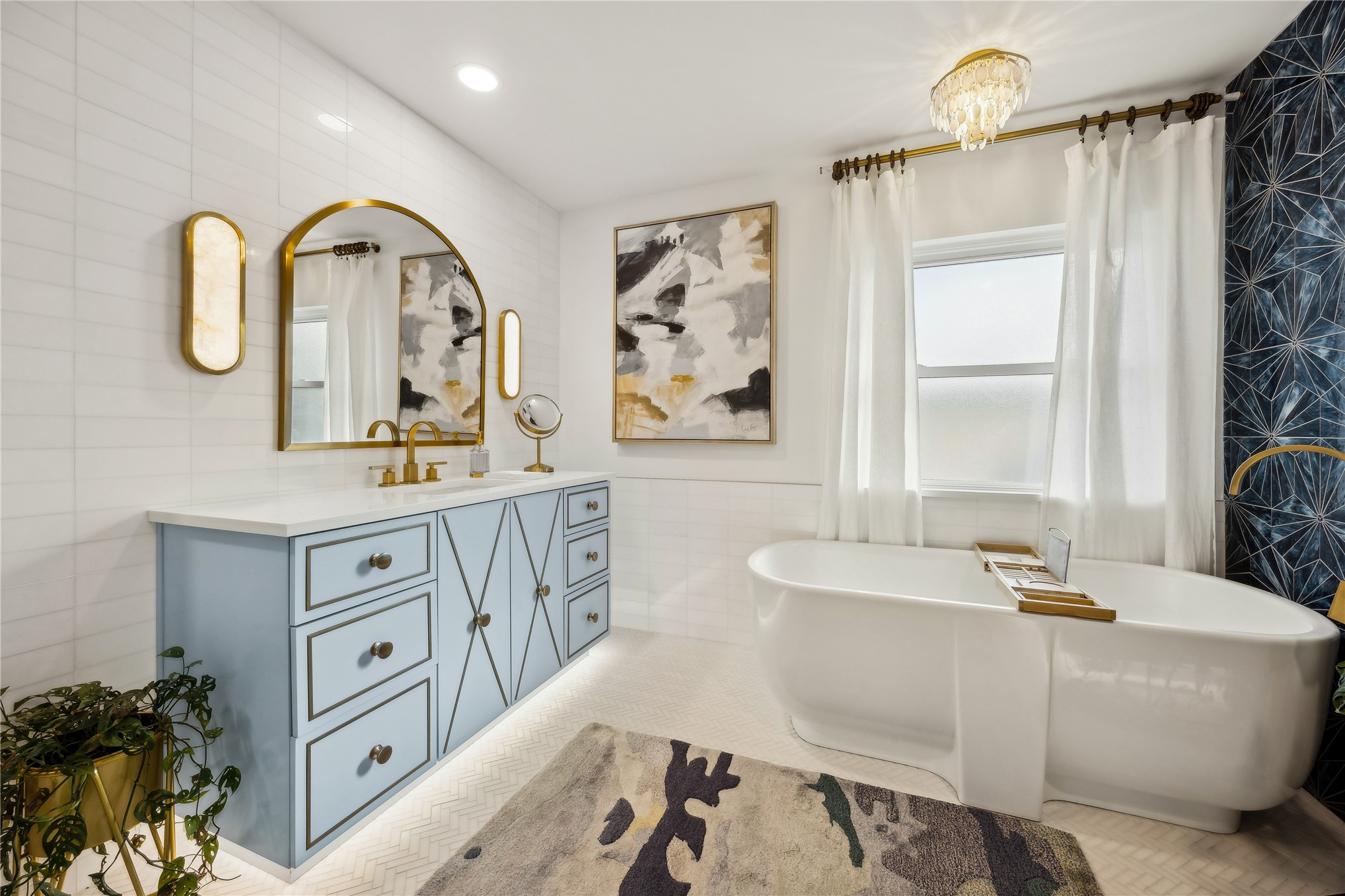 95103 Greenberry Road Fernandina Beach, FL 32034 - Photo 19 of 69 a bathroom with a double vanity sink a mirror and a bathtub