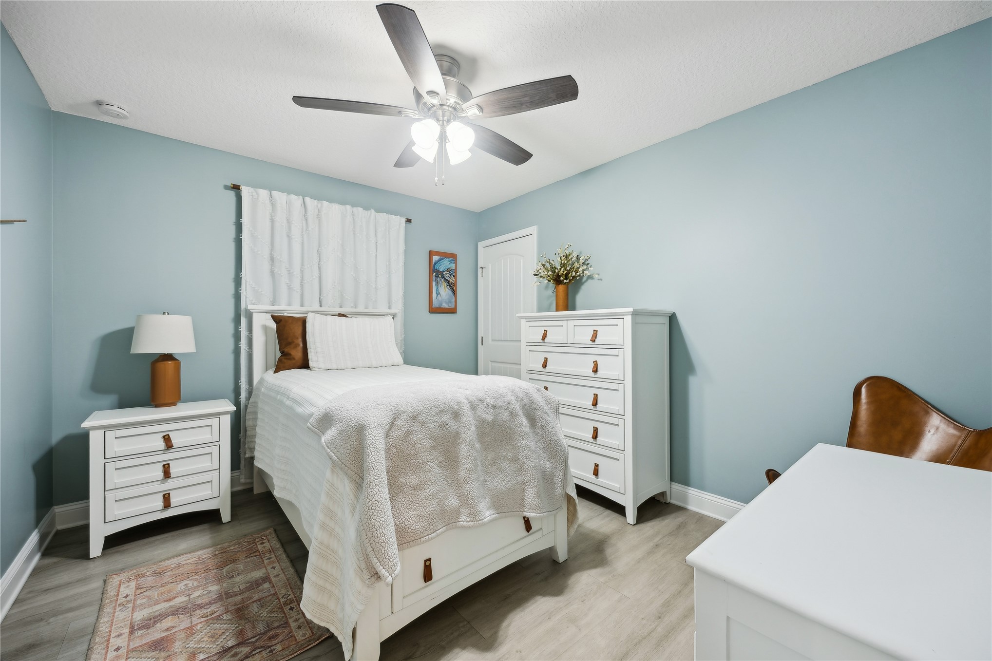 95103 Greenberry Road Fernandina Beach, FL 32034 - Photo 21 of 69 a bedroom with a bed and a chandelier