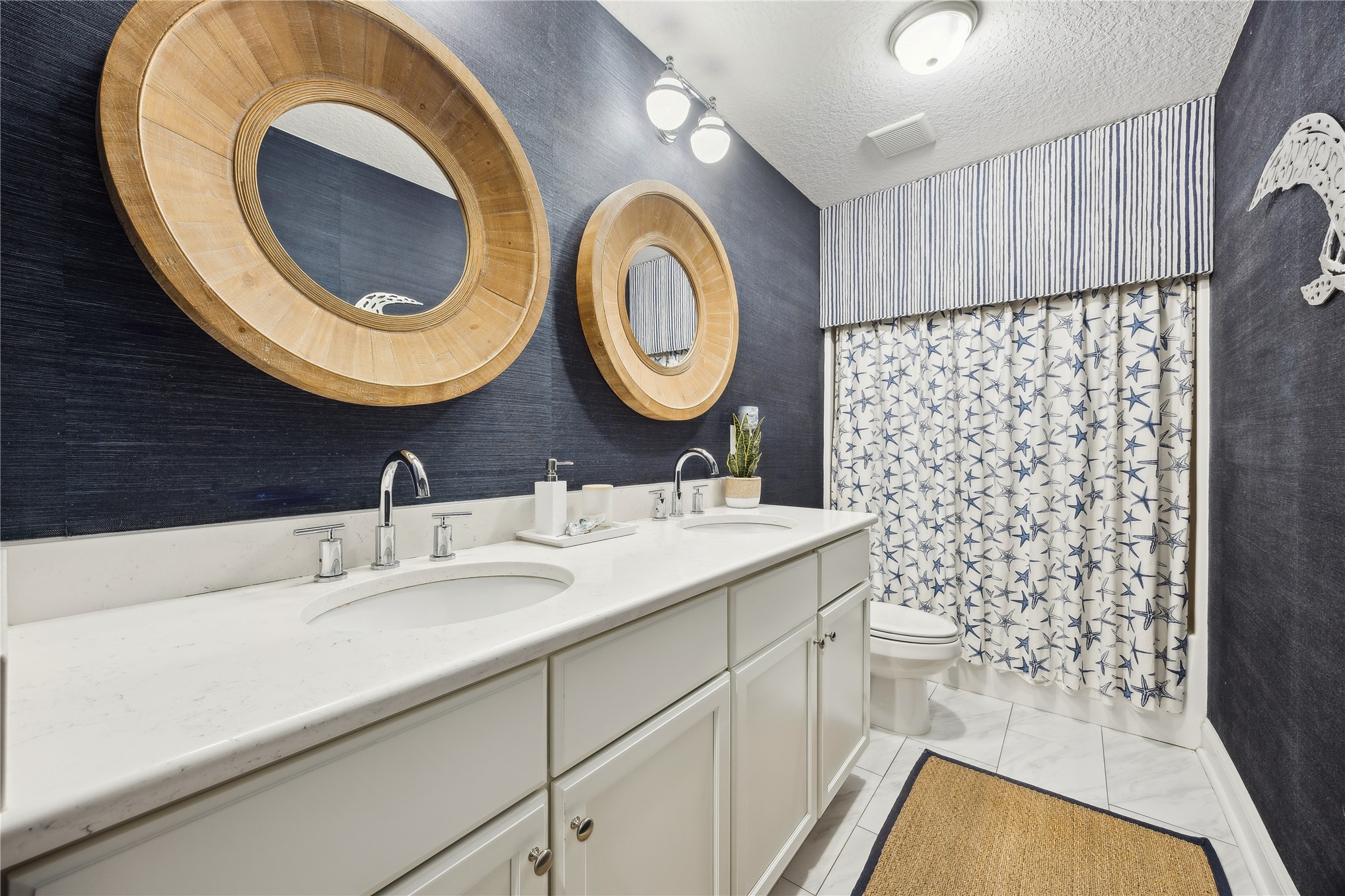 95103 Greenberry Road Fernandina Beach, FL 32034 - Photo 24 of 69 a bathroom with a sink a toilet and a mirror