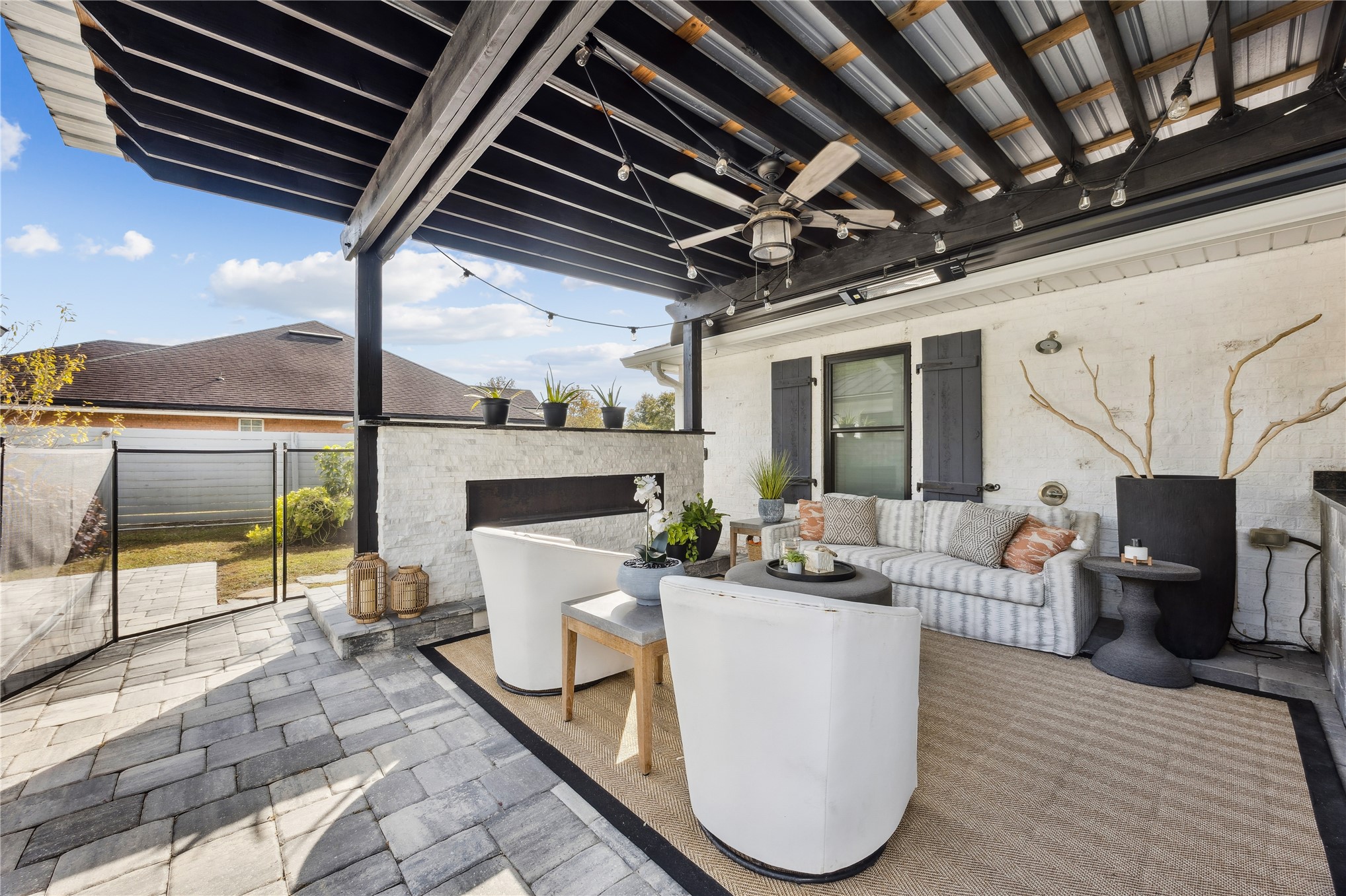 95103 Greenberry Road Fernandina Beach, FL 32034 - Photo 32 of 69 a view of a patio with couches chairs and a wooden floor