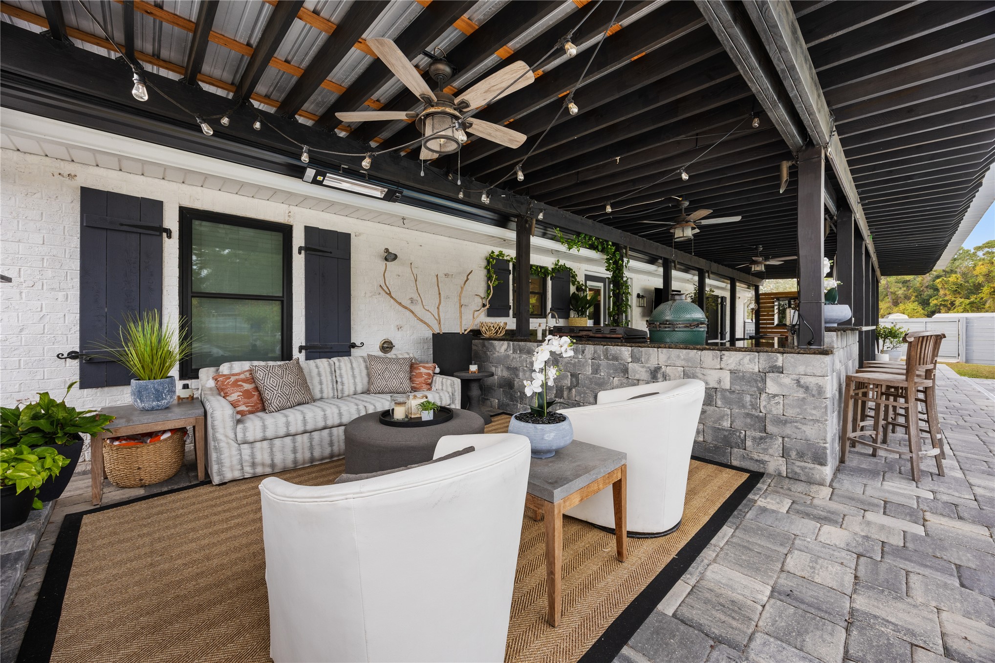 95103 Greenberry Road Fernandina Beach, FL 32034 - Photo 34 of 69 a view of a patio with couches table and chairs with potted plants