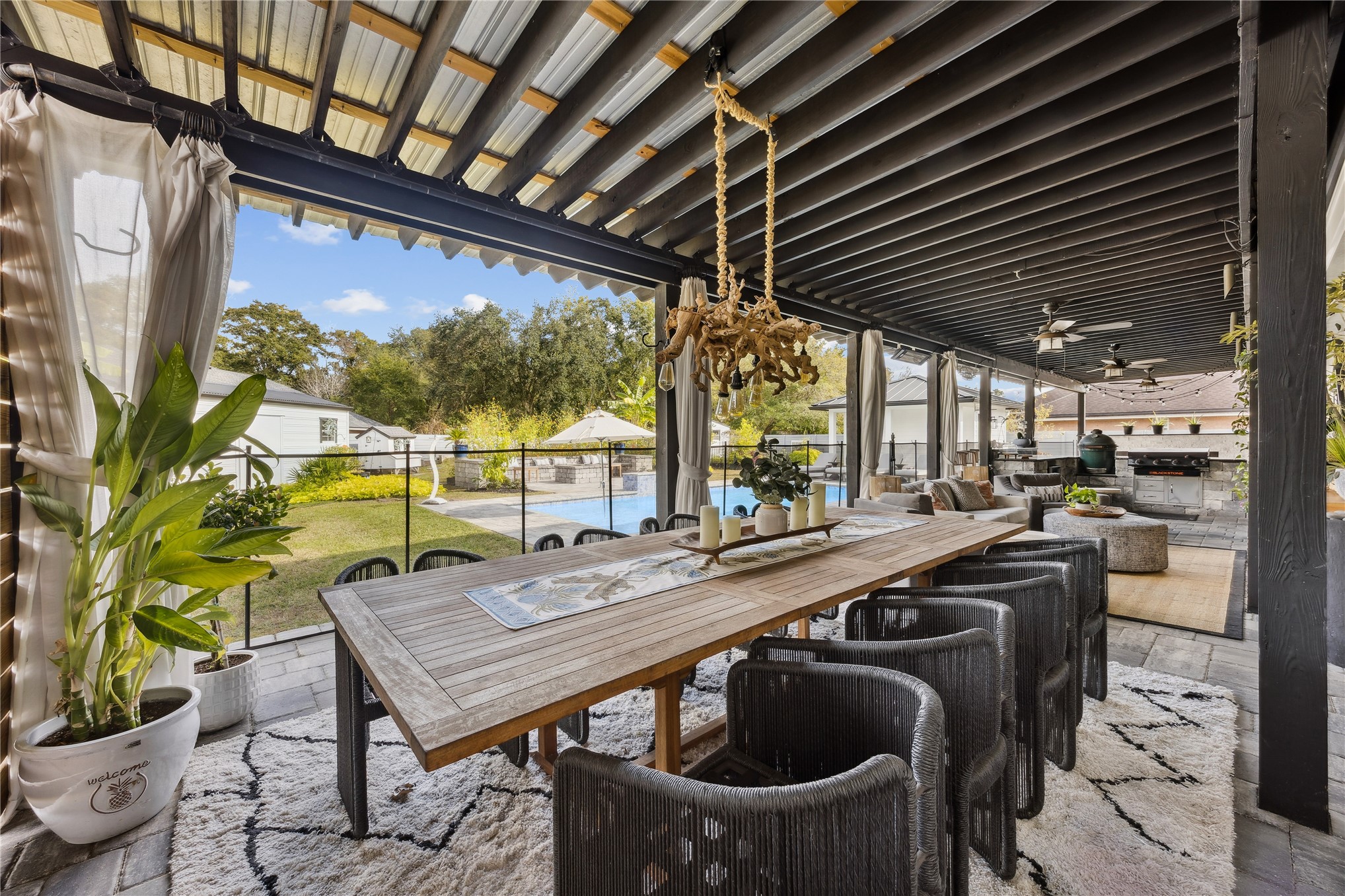 95103 Greenberry Road Fernandina Beach, FL 32034 - Photo 40 of 69 a view of a patio with table and chairs and potted plants