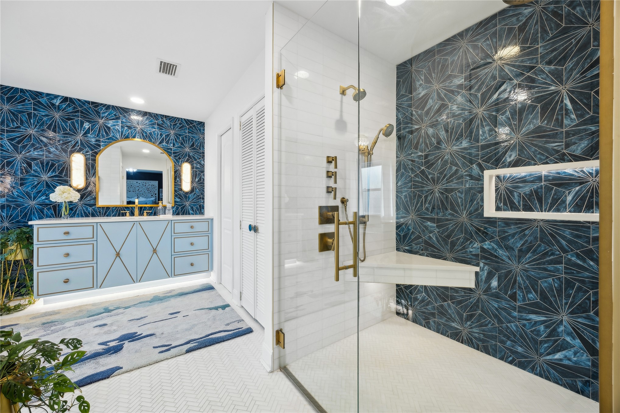 95103 Greenberry Road Fernandina Beach, FL 32034 - Photo 4 of 69 a spacious bathroom with a sink a mirror and a shower