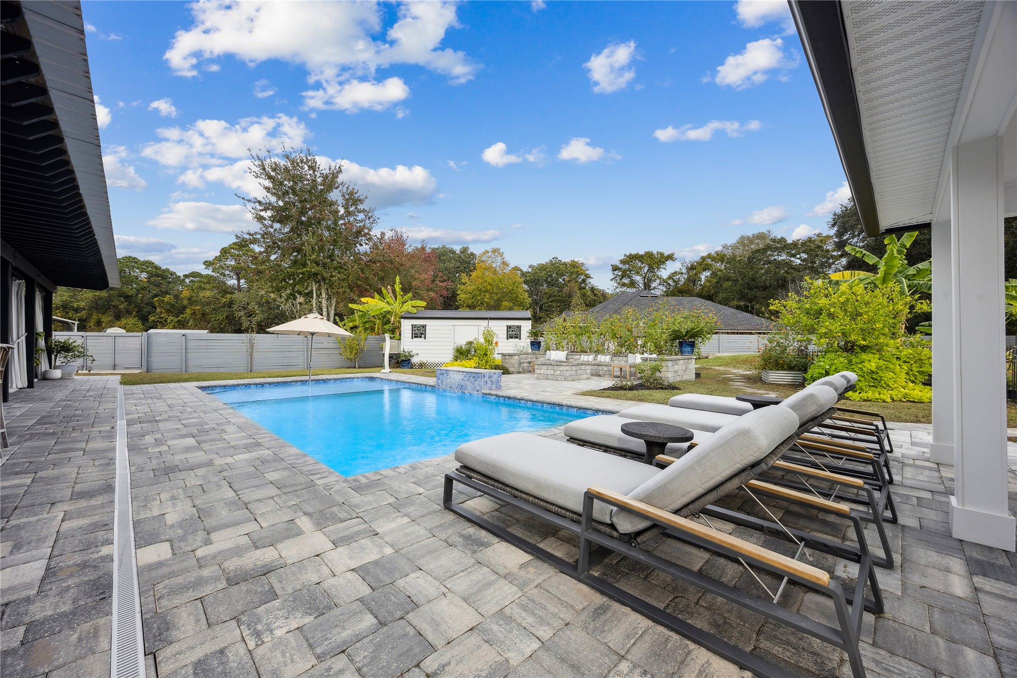 95103 Greenberry Road Fernandina Beach, FL 32034 - Photo 42 of 69 a view of a swimming pool with a patio and a yard