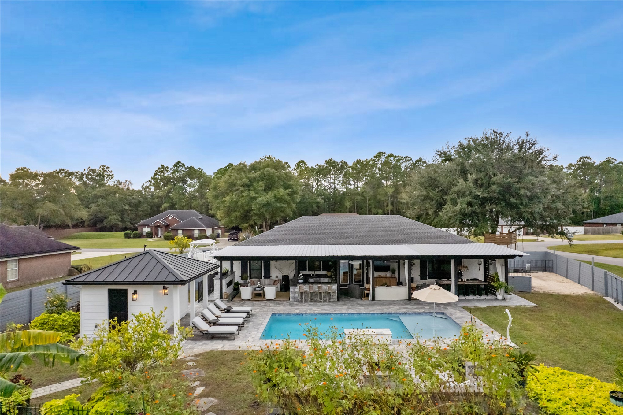 95103 Greenberry Road Fernandina Beach, FL 32034 - Photo 5 of 69 a view of a house with pool garden and trees