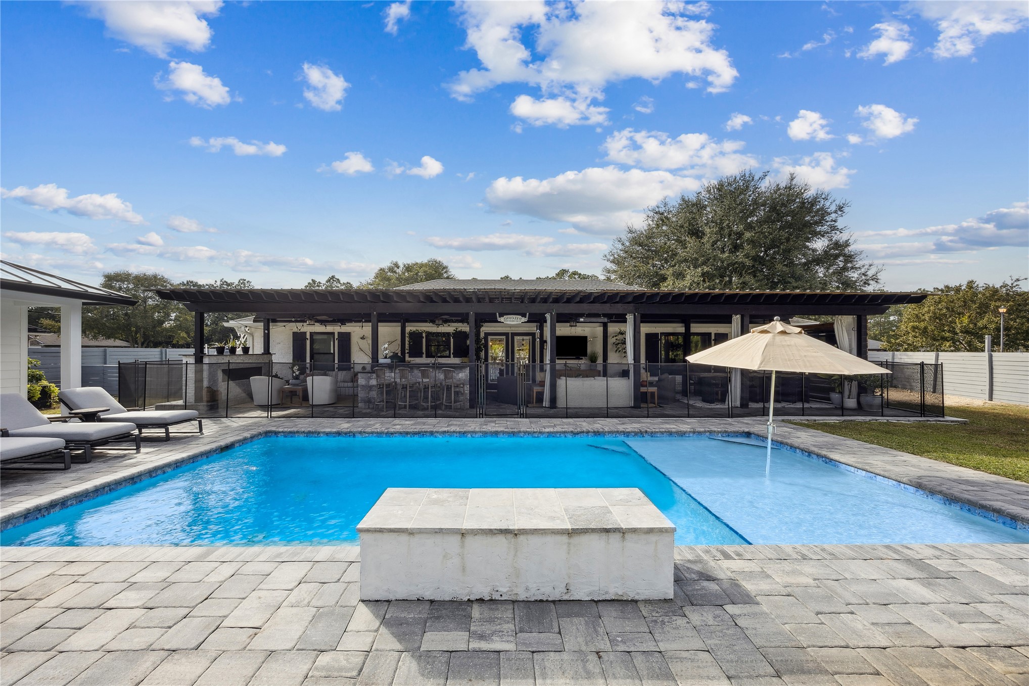95103 Greenberry Road Fernandina Beach, FL 32034 - Photo 52 of 69 a view of a house with swimming pool and sitting area