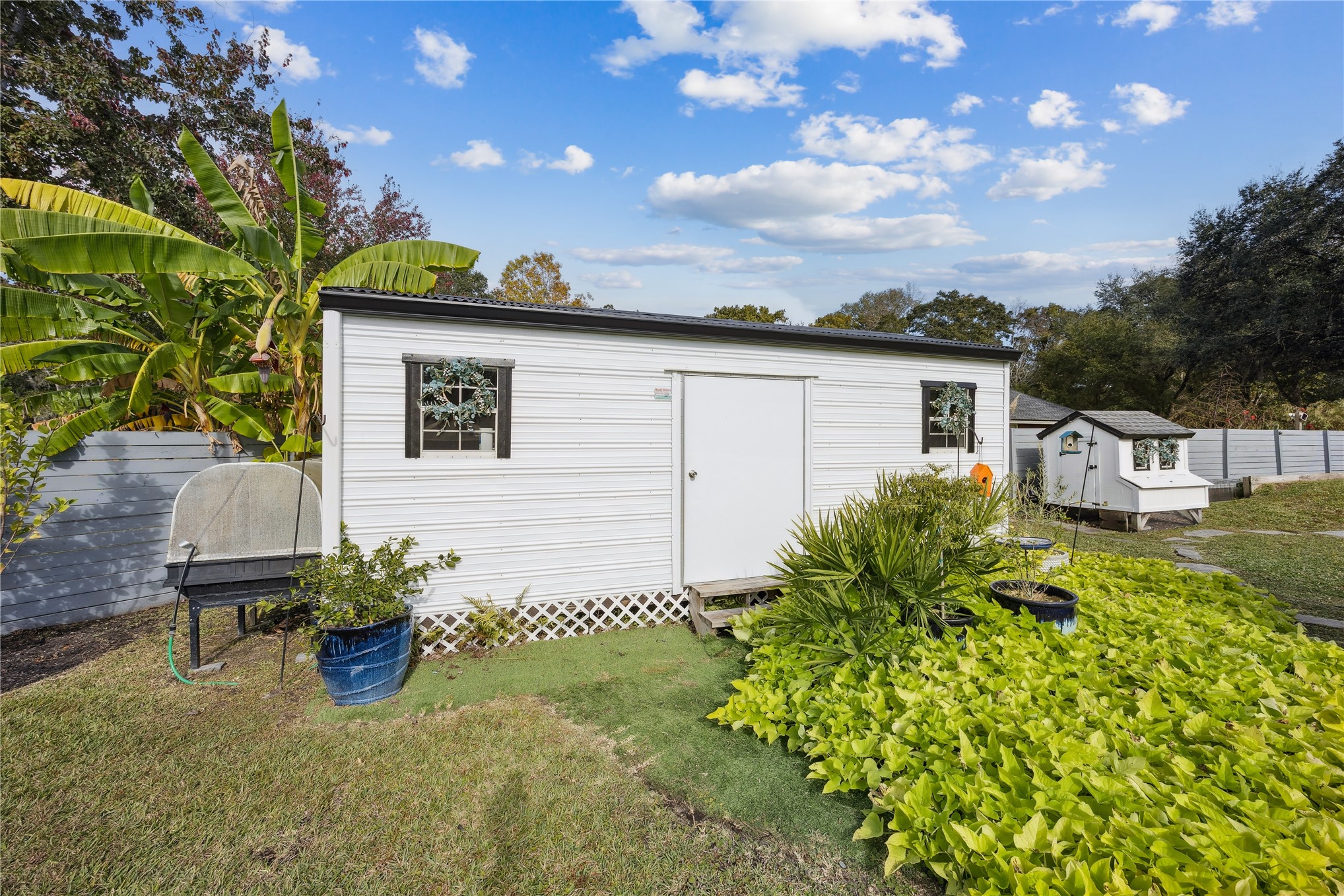 95103 Greenberry Road Fernandina Beach, FL 32034 - Photo 53 of 69 a view of a chair and table in backyard of the house