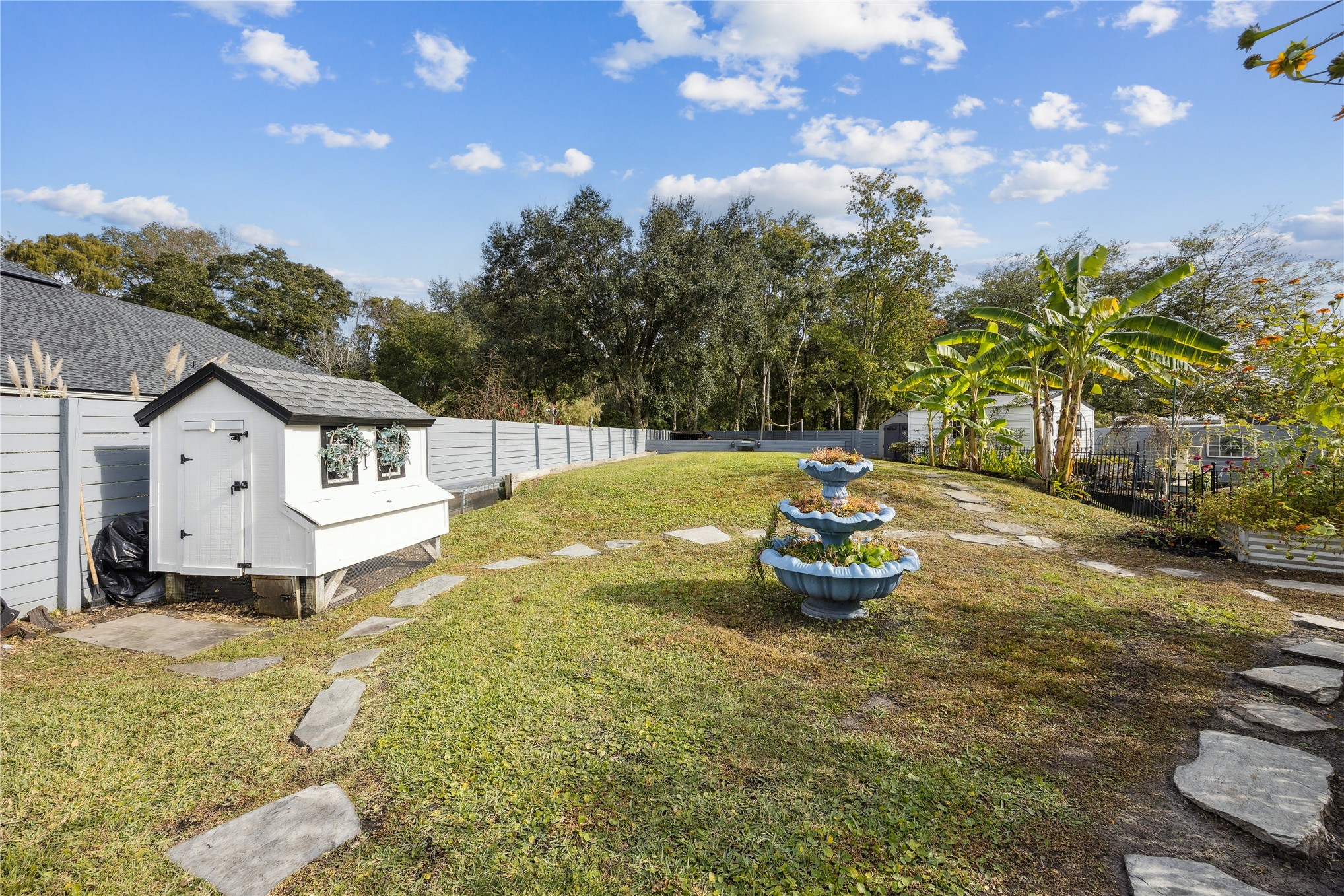 95103 Greenberry Road Fernandina Beach, FL 32034 - Photo 57 of 69 a front view of a house with a yard