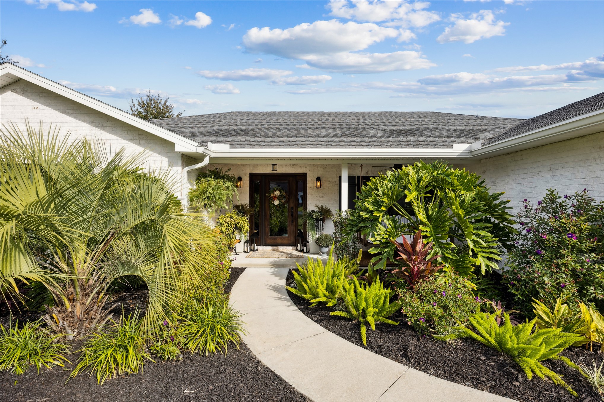 95103 Greenberry Road Fernandina Beach, FL 32034 - Photo 6 of 69 a front view of a house with a yard