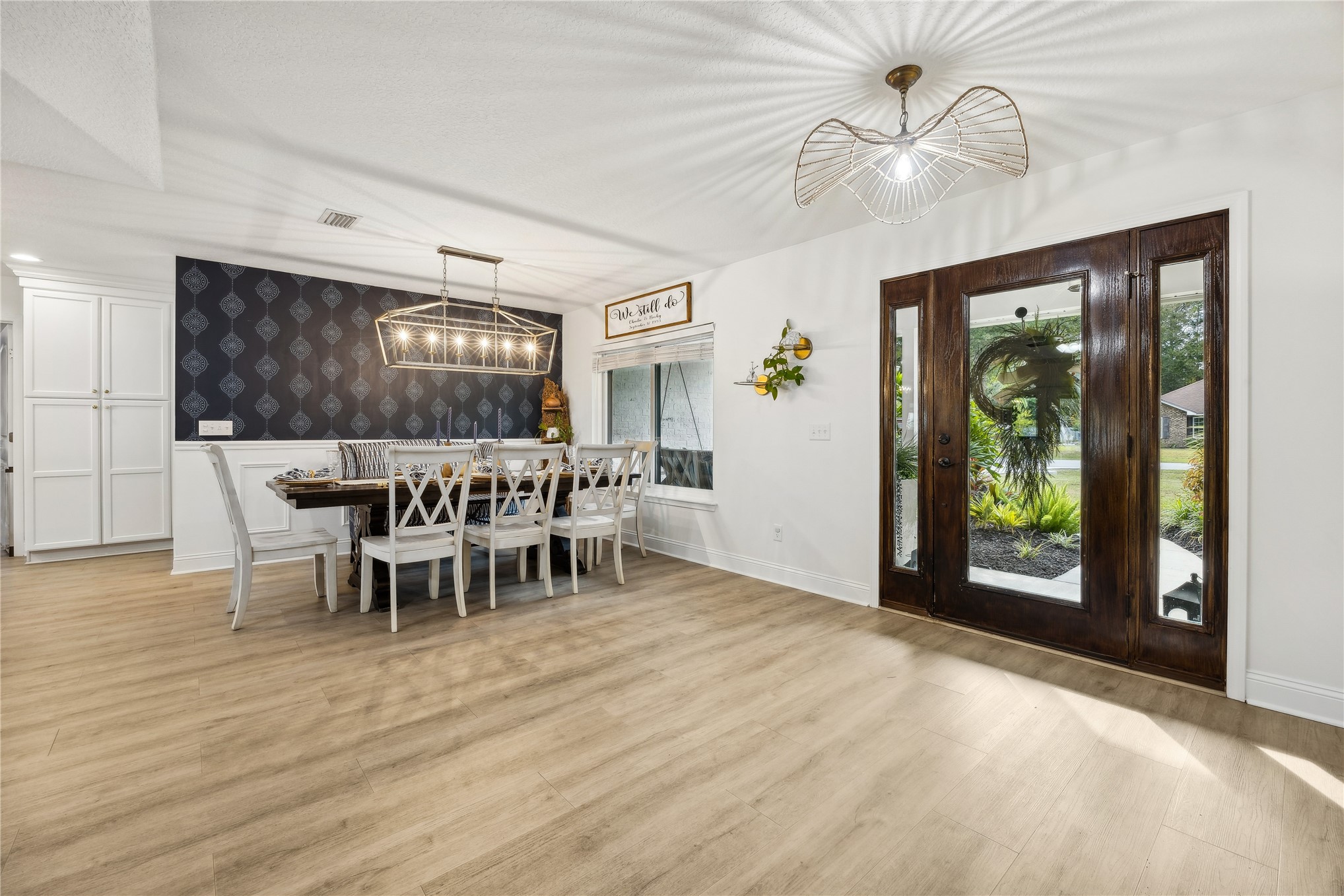 95103 Greenberry Road Fernandina Beach, FL 32034 - Photo 9 of 69 a view of a dining room with furniture window and wooden floor