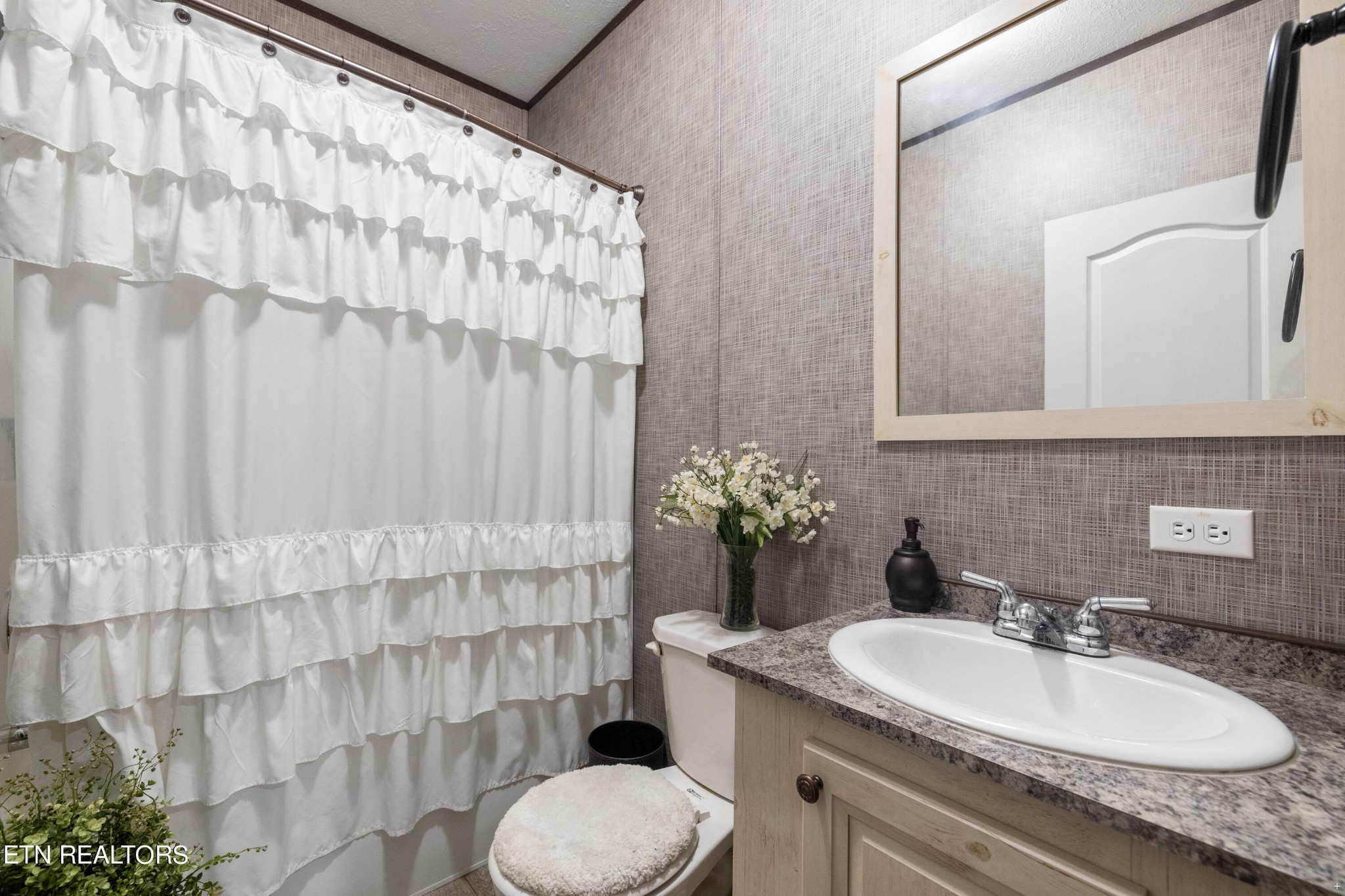 711 Gamble Drive Heiskell, TN 37754 - Photo 13 of 17 a bathroom with a sink and a mirror