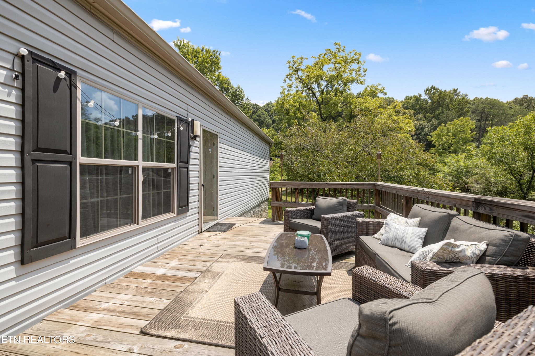 711 Gamble Drive Heiskell, TN 37754 - Photo 8 of 17 a balcony with furniture and a garden
