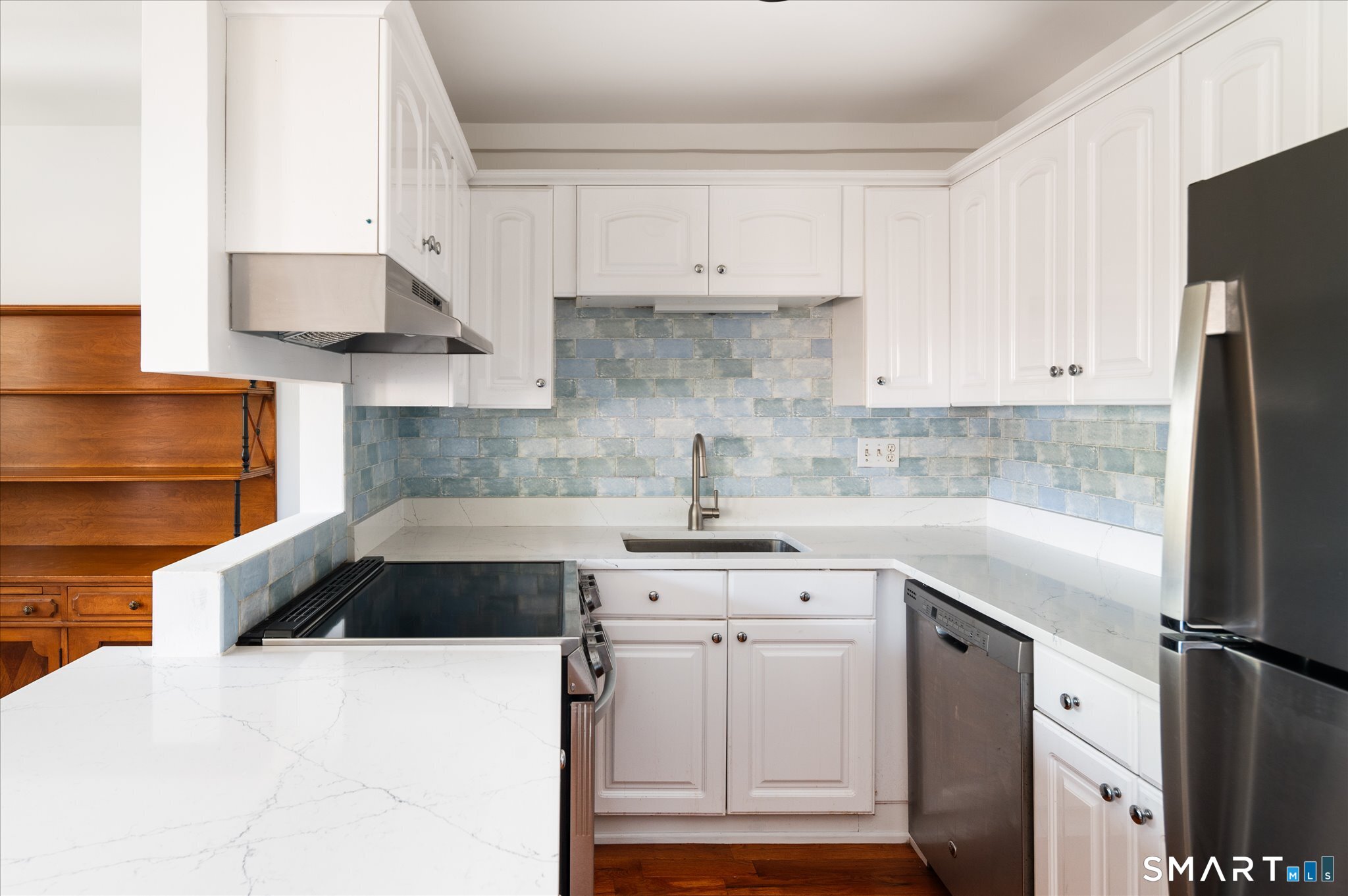 154 Cold Spring Road, Unit 23 Stamford, CT 06905 - Photo 3 of 34 You will love the updated kitchen with breakfast bar. Counters and appliances were updated in 2025