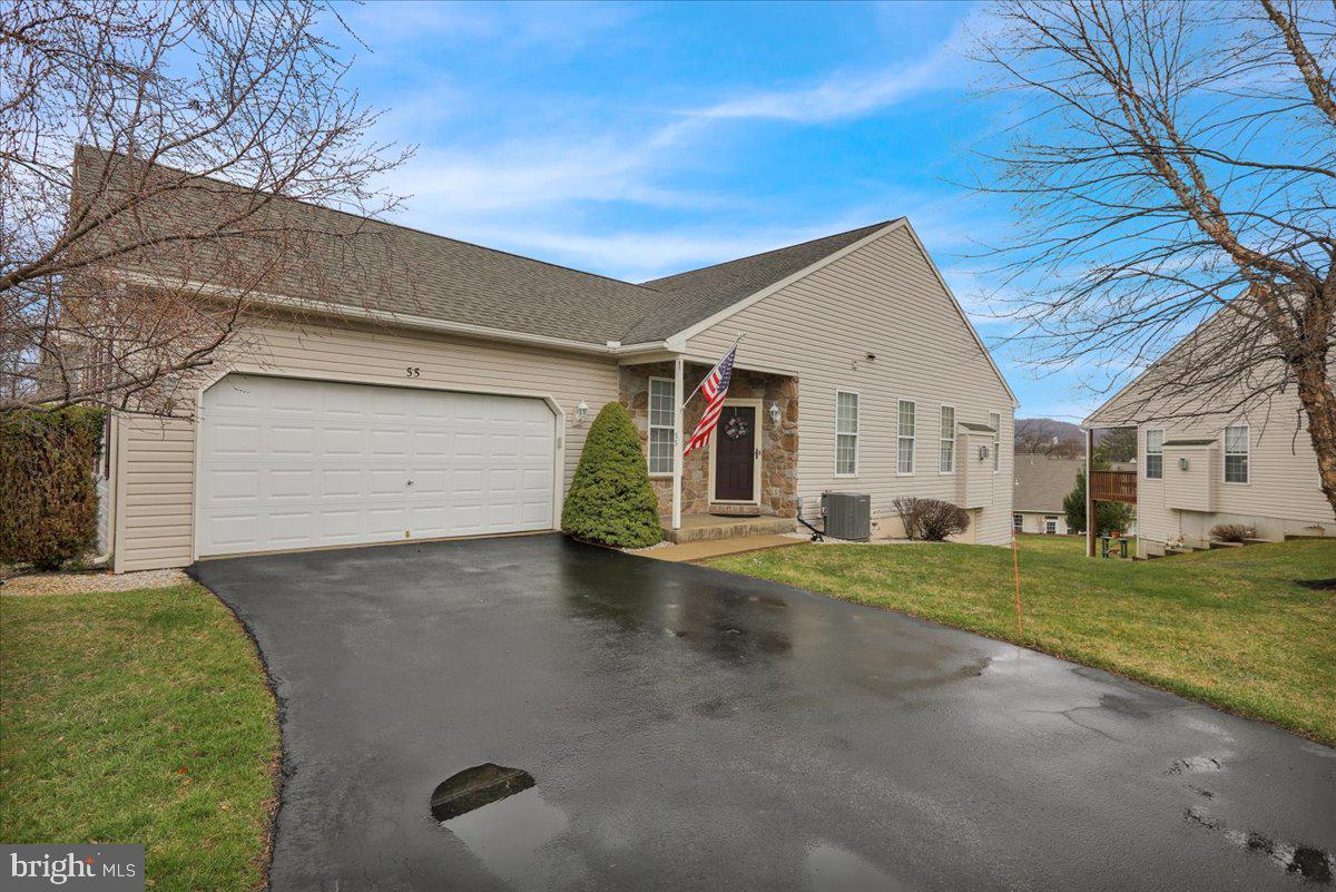 55 Turning Leaf Way Reading, PA 19605 - Photo 2 of 37 a view of a house with a yard and garage