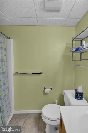 a bathroom with a toilet and a sink