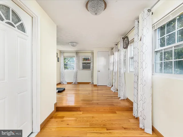 a view of a bathroom with a tub and windows