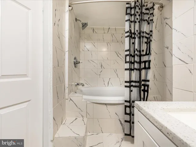 a bathroom with a sink and a bathtub