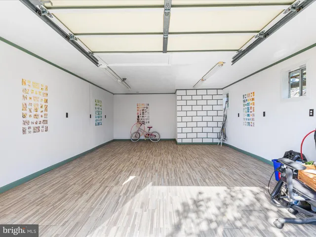 a view of livingroom with clothes and toys