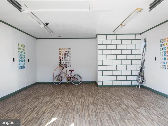 a view of a livingroom with furniture and hardwood floor