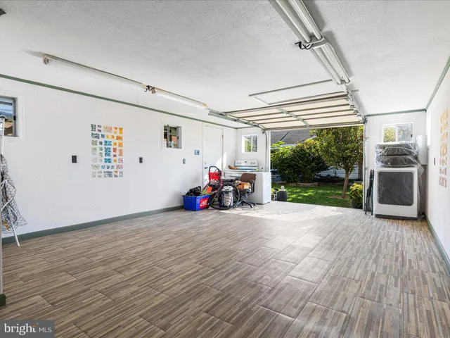a view of a backyard with a tree
