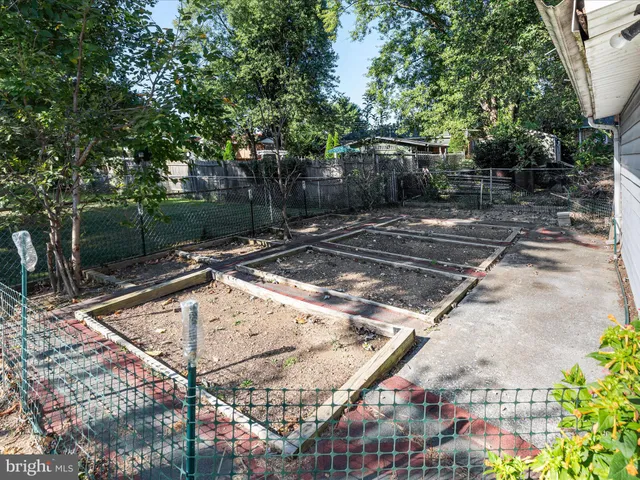 a view of backyard with a garden and entertaining space