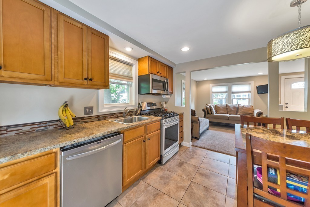 48 Drexel Street Springfield, MA 01104 - Photo 1 of 24 a kitchen with stainless steel appliances granite countertop sink stove and granite counter top