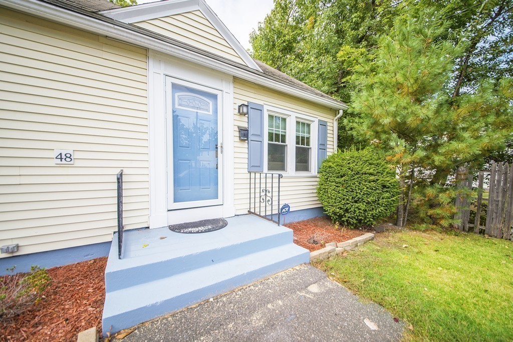 48 Drexel Street Springfield, MA 01104 - Photo 18 of 24 a front view of a house with a garden