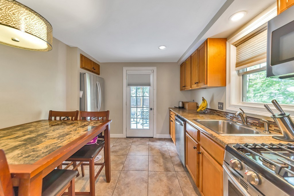48 Drexel Street Springfield, MA 01104 - Photo 2 of 24 a kitchen that has a sink and a stove